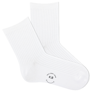 White ribbed women's socks with a smiley face and 'KB' logo on a white background