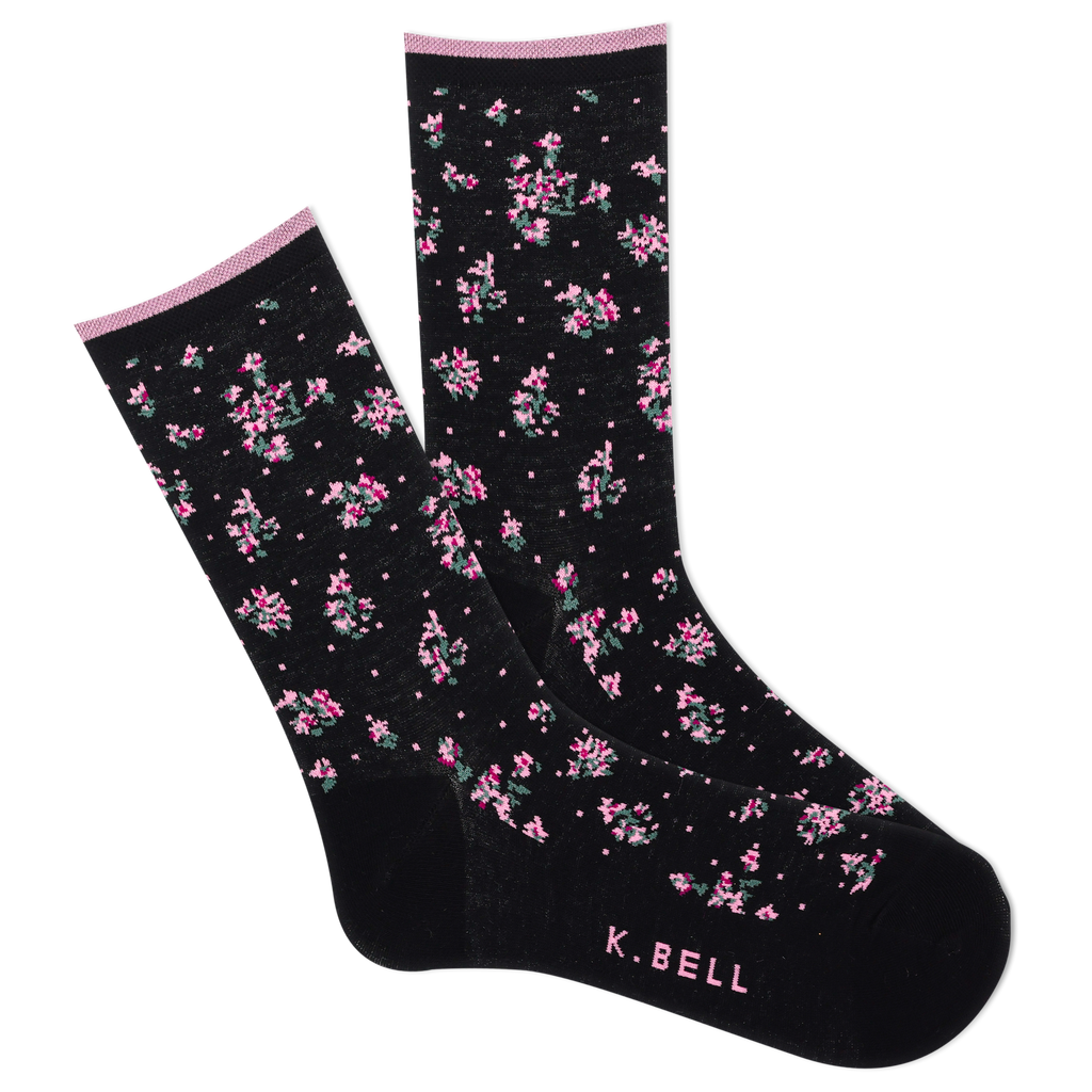 A pair of women's crew socks with a floral pattern in black, blue, and pink colors, featuring the brand name 'K.Bell' on the foot.