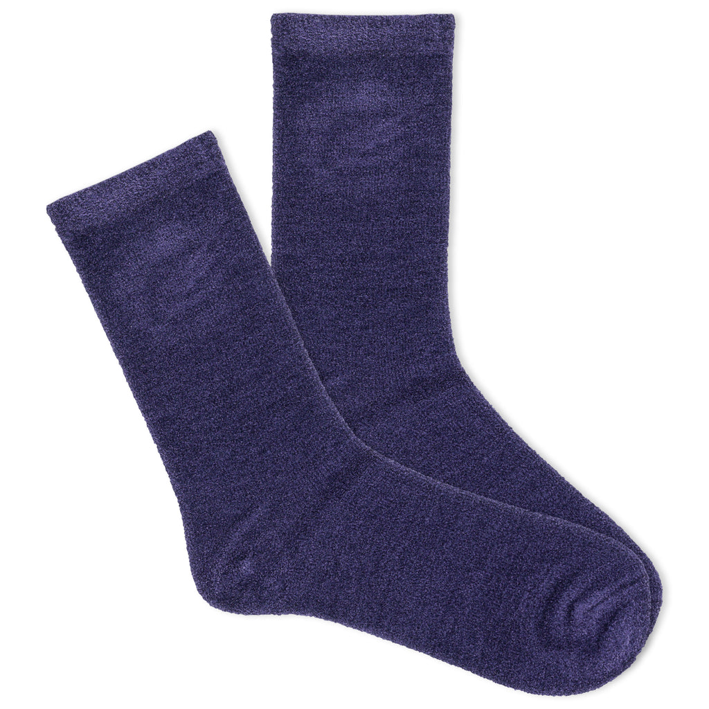 A pair of women's velvet crew socks in a beige color.
