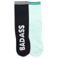 Two ankle socks, one black and one white, with the word 'BADASS' written across the cuffs and a reflective logo on the black sock.