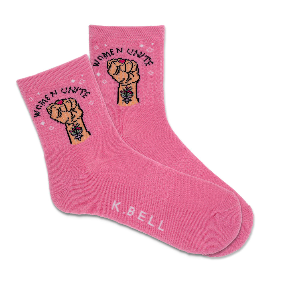 A pair of pink active crew socks with 'Women Unite' text and a fist graphic, and the brand name 'K.Bell' displayed at the bottom.