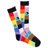 A pair of men's crew socks with a multicolored patch design featuring symbols such as hearts and peace signs.