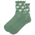 A pair of green crew socks with a lettuce edge design and white golf ball patterns, displayed on a piece of grass next to a golf club and two golf balls.