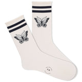 A pair of white roll-top crew socks with a black butterfly and two stripes design at the cuff.