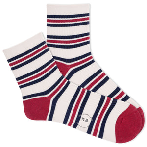Beige K.Bell socks with navy and red stripes.