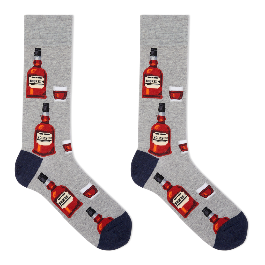 A pair of men's crew socks with a bourbon design, featuring illustrations of bourbon bottles and a glass on a gray background.