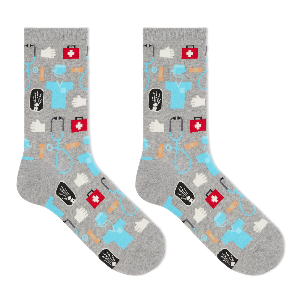 A pair of women's crew socks with a medical supplies print including images of a stethoscope, pills, and a hospital badge.